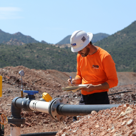 Carlotta Mine Arizona Leach Pads - man inspects pipeline